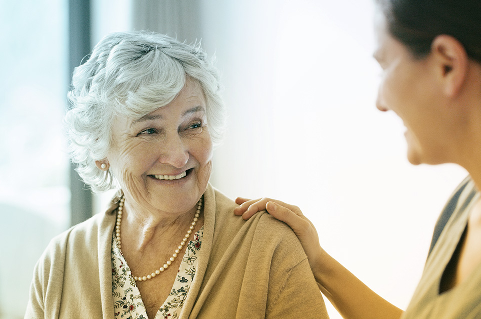 Older Woman Smiling at nurse